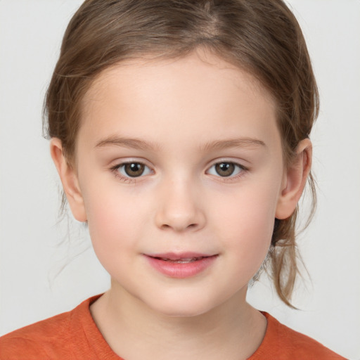 Joyful white child female with medium  brown hair and brown eyes