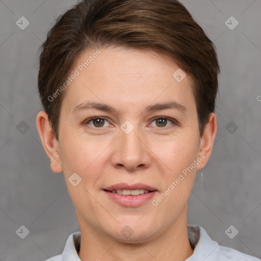 Joyful white adult female with short  brown hair and grey eyes