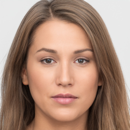 Neutral white young-adult female with long  brown hair and brown eyes