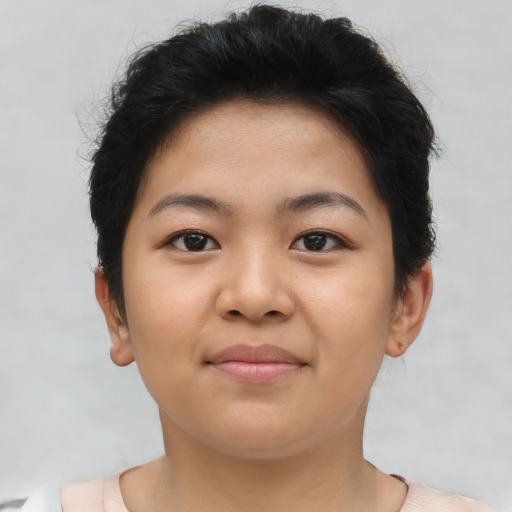Joyful asian young-adult female with short  brown hair and brown eyes