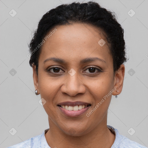 Joyful latino young-adult female with short  brown hair and brown eyes