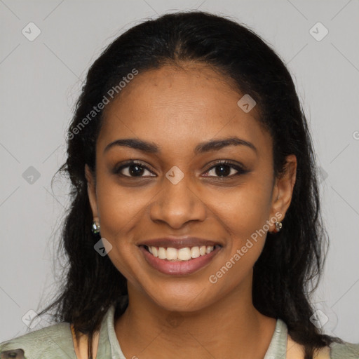 Joyful black young-adult female with long  brown hair and brown eyes