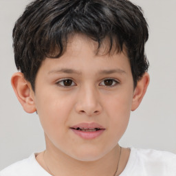 Joyful white child male with short  brown hair and brown eyes