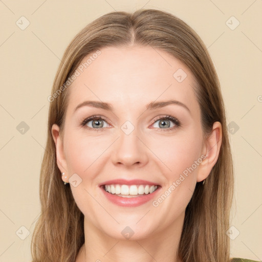 Joyful white young-adult female with long  brown hair and green eyes