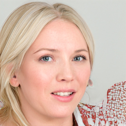 Joyful white young-adult female with medium  blond hair and blue eyes