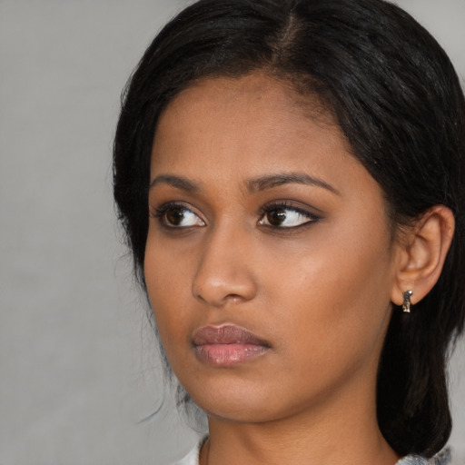 Neutral asian young-adult female with medium  black hair and brown eyes