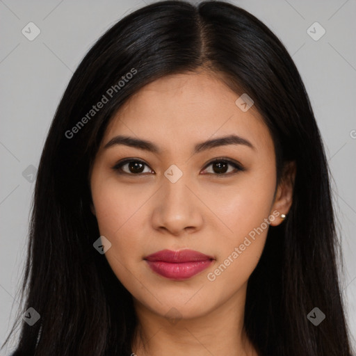 Joyful latino young-adult female with long  brown hair and brown eyes