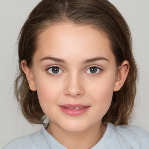 Joyful white child female with medium  brown hair and brown eyes