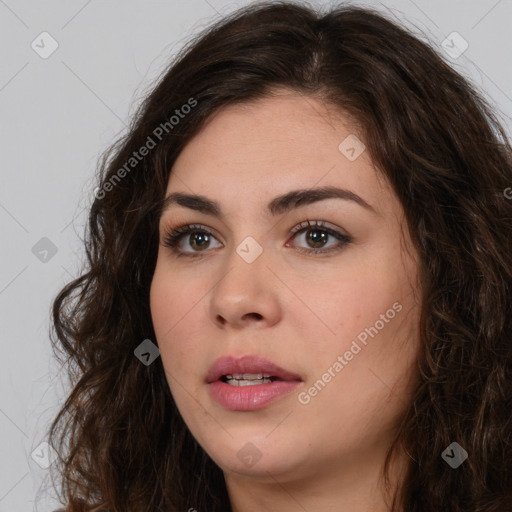 Neutral white young-adult female with long  brown hair and brown eyes