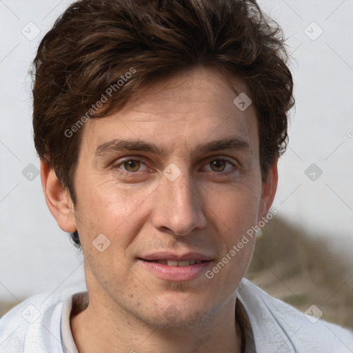 Joyful white adult male with short  brown hair and grey eyes