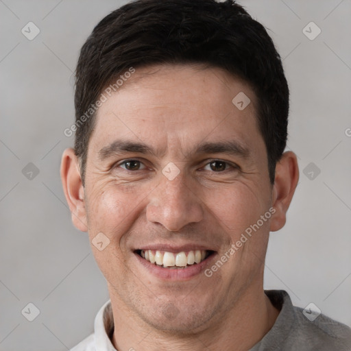 Joyful white adult male with short  brown hair and brown eyes