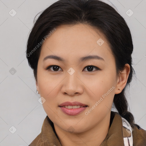 Joyful asian young-adult female with medium  brown hair and brown eyes