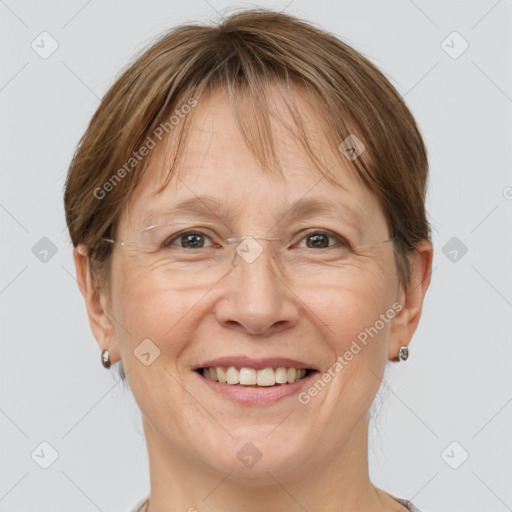 Joyful white adult female with medium  brown hair and grey eyes