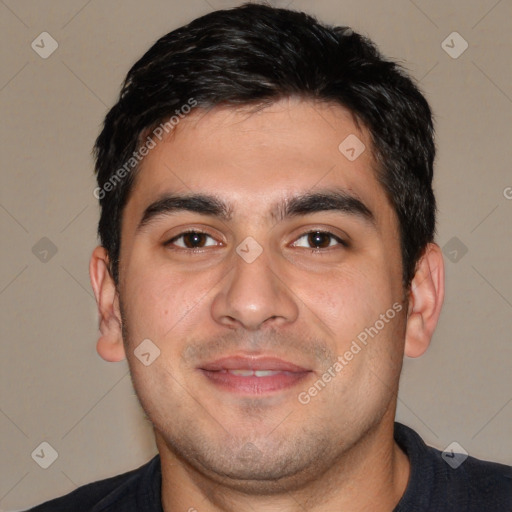 Joyful white young-adult male with short  black hair and brown eyes