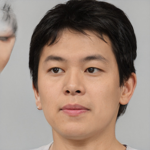 Neutral asian young-adult male with short  brown hair and brown eyes