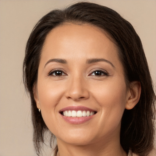 Joyful white young-adult female with medium  brown hair and brown eyes