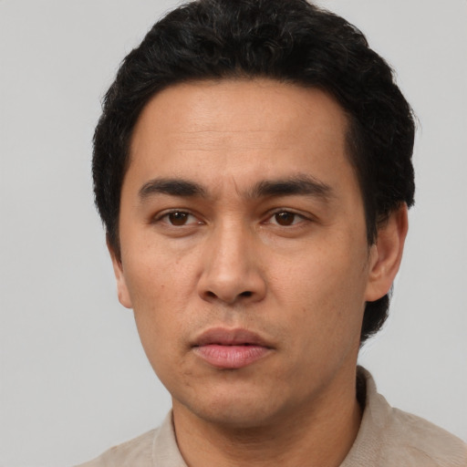 Neutral asian adult male with short  black hair and brown eyes