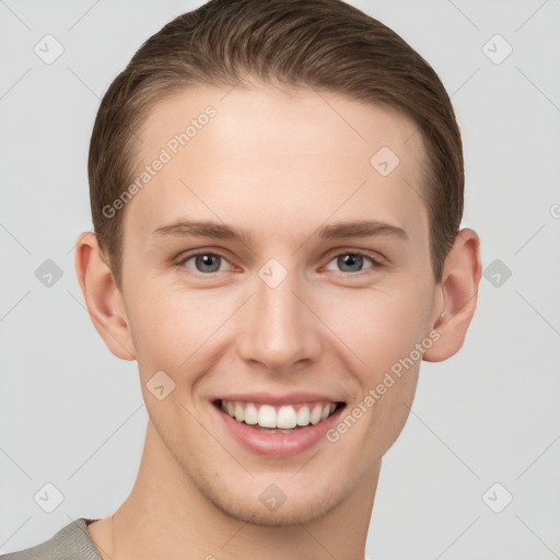 Joyful white young-adult female with short  brown hair and grey eyes