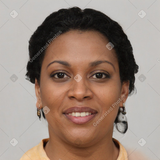Joyful black young-adult female with short  brown hair and brown eyes