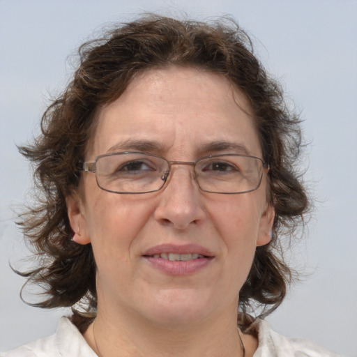 Joyful white middle-aged female with medium  brown hair and brown eyes