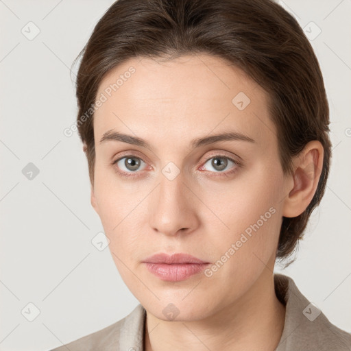 Neutral white young-adult female with medium  brown hair and grey eyes