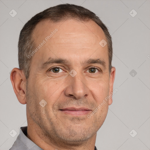 Joyful white adult male with short  brown hair and brown eyes