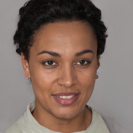 Joyful latino young-adult female with short  brown hair and brown eyes