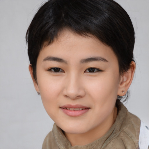 Joyful asian young-adult female with medium  brown hair and brown eyes