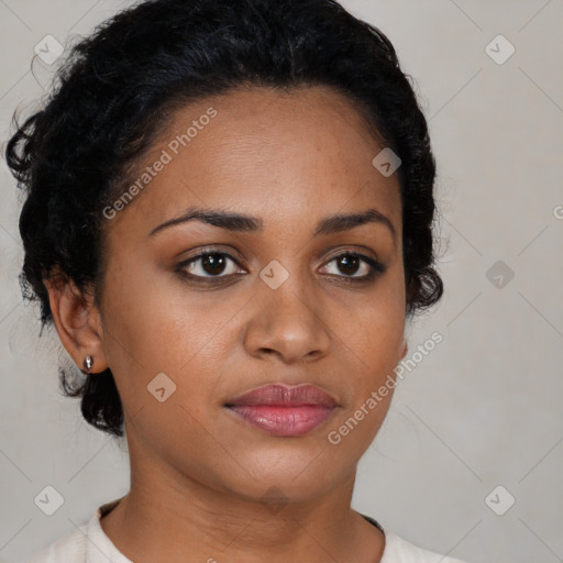 Joyful black young-adult female with short  black hair and brown eyes