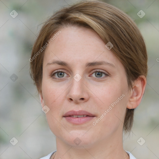 Joyful white young-adult female with medium  brown hair and blue eyes