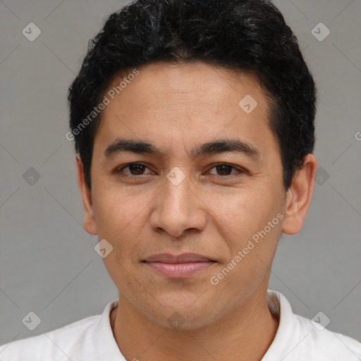 Joyful latino young-adult male with short  black hair and brown eyes