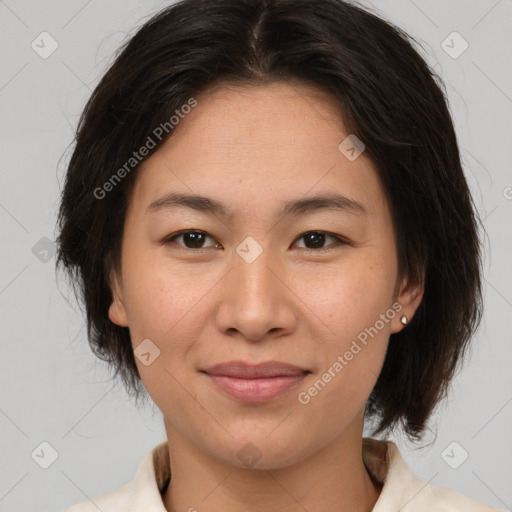 Joyful asian young-adult female with medium  brown hair and brown eyes