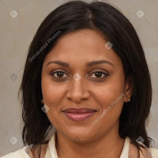 Joyful black adult female with medium  brown hair and brown eyes