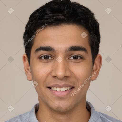 Joyful latino young-adult male with short  black hair and brown eyes