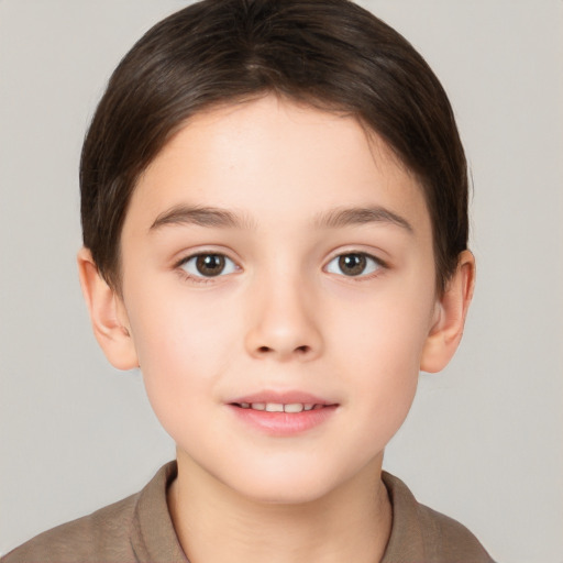 Joyful white child female with short  brown hair and brown eyes