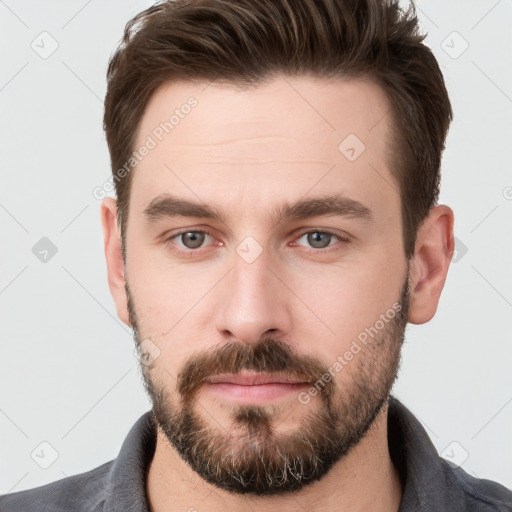 Neutral white young-adult male with short  brown hair and grey eyes