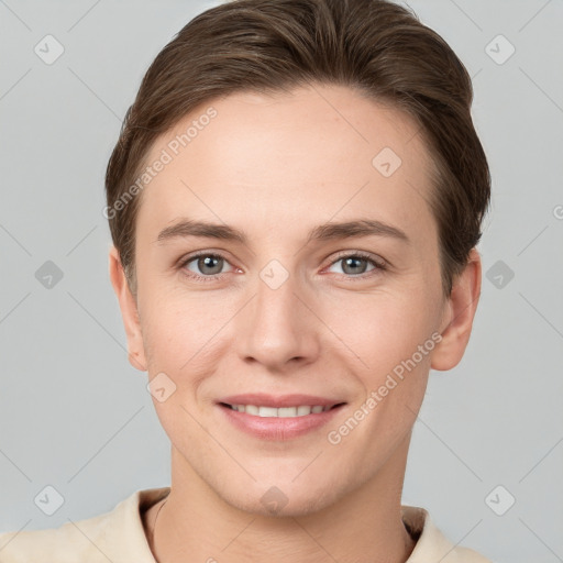 Joyful white young-adult female with short  brown hair and grey eyes