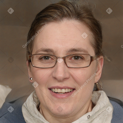 Joyful white adult female with medium  brown hair and blue eyes