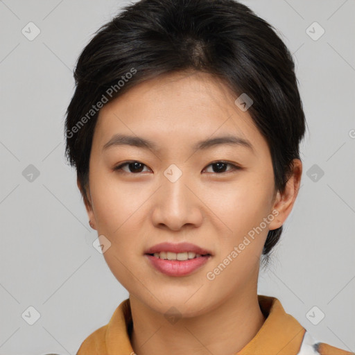 Joyful asian young-adult female with short  brown hair and brown eyes