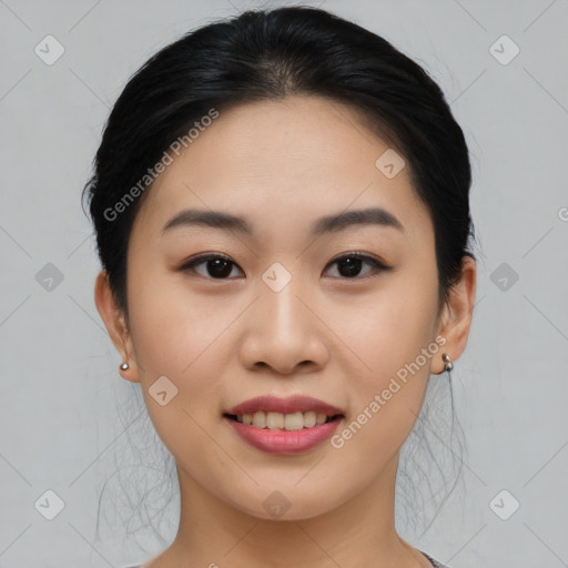 Joyful asian young-adult female with medium  black hair and brown eyes