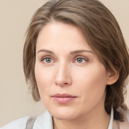 Neutral white young-adult female with medium  brown hair and grey eyes