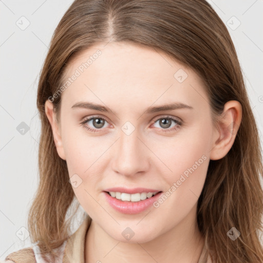 Joyful white young-adult female with long  brown hair and grey eyes