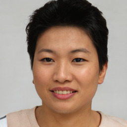 Joyful asian young-adult female with short  brown hair and brown eyes