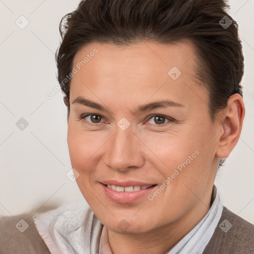 Joyful white adult female with short  brown hair and brown eyes