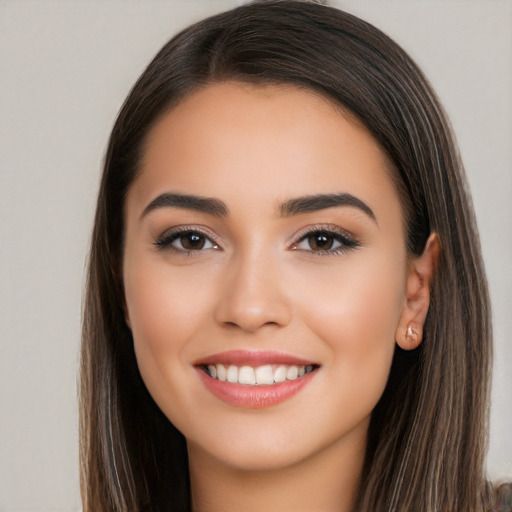 Joyful white young-adult female with long  brown hair and brown eyes