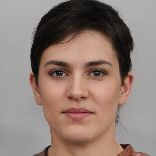 Joyful white young-adult female with short  brown hair and brown eyes