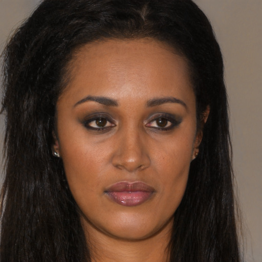 Neutral black young-adult female with long  brown hair and brown eyes