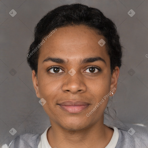 Joyful black young-adult female with short  black hair and brown eyes