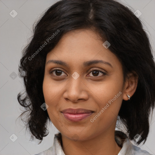 Joyful black young-adult female with medium  brown hair and brown eyes