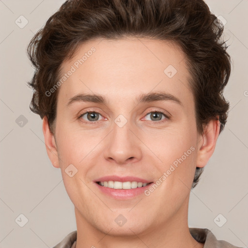 Joyful white young-adult female with short  brown hair and grey eyes